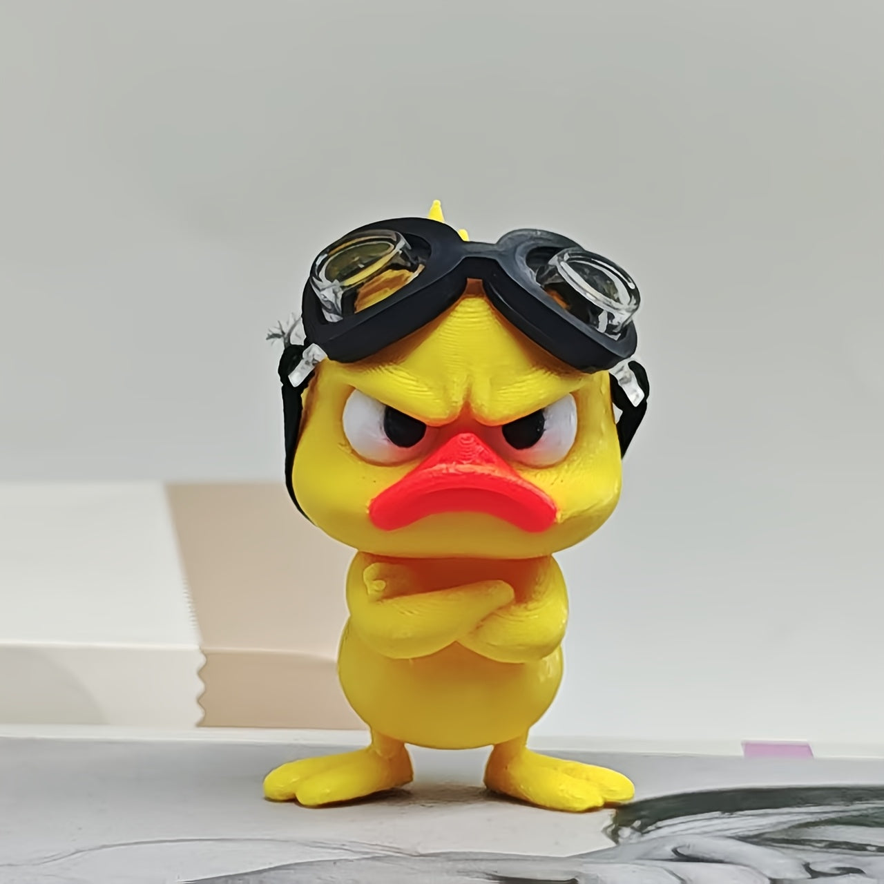 Tnessential An Angry Little Yellow Duck Figurine with Swimming Goggles 3D Decor